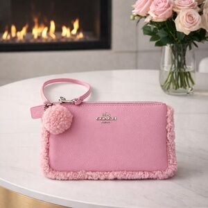 Coach Pink Shearling Wristlet with Pom Pom.